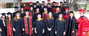 Group picture of UNR graduates wearing cap and gowns