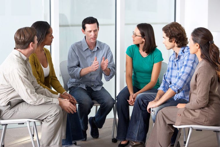 Clinical social worker leads a group therapy session